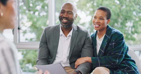 Couple talking with advisor
